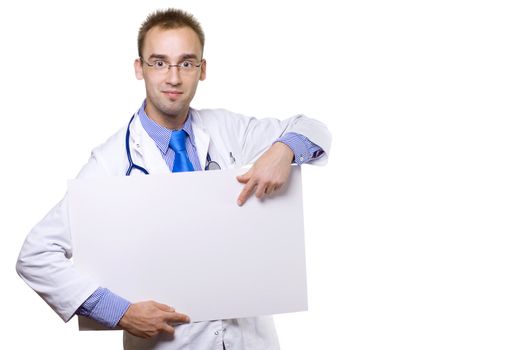 smiling young male doctor holding blank board and pointing