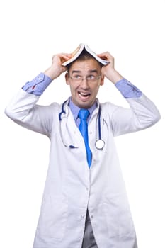 funny young doctor balancing book on his head