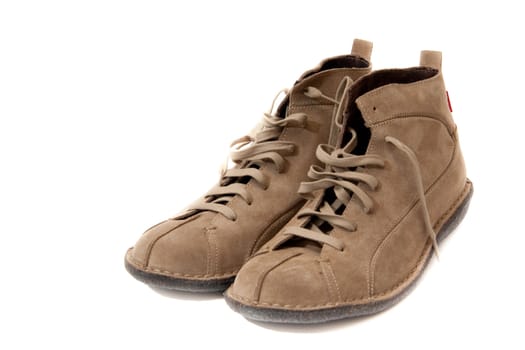 Pair of beige shoes with loose laces