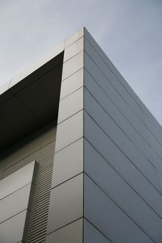 steel wall of modern trade center over the blue sky