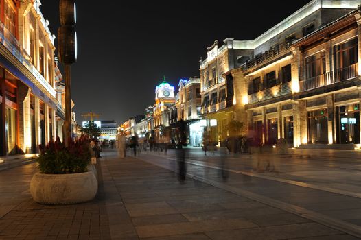 A lit up walking street
