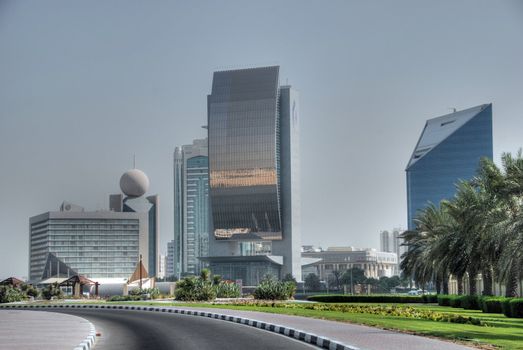 Dubai street and some skyscrapers on a hot summer day