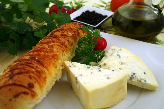 french cheese and bread with cheese, wine, some herbs, nuts and pepper