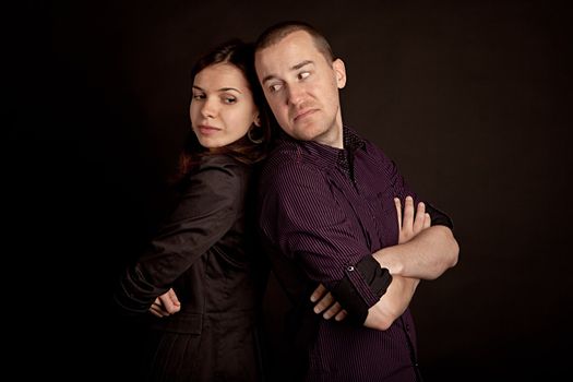 Portrait of young men and woman. Studio shot