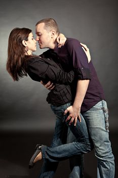 Passionate young couple. Three quarter studio shot