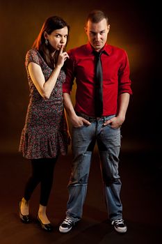 Young beautiful couple. Studio shot. Full-length shot