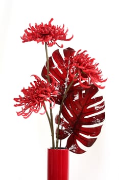 Bouquet in a vase from red artificial flowers