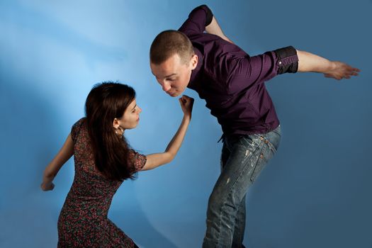 Men beaten up by women. Studio shot