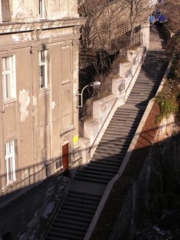 Detail from old part of Belgrade town, steps from shadow to sun, diagonaly over photo.