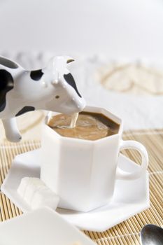 coffees and a cream in cow-like pot - hi res 12,7 mpix