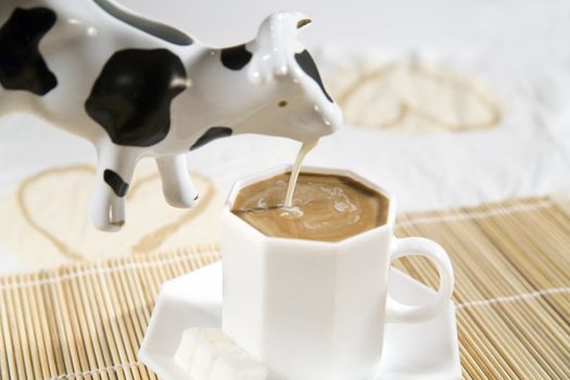coffee and a cream in cow-like pot - hi res 12,7 mpix
