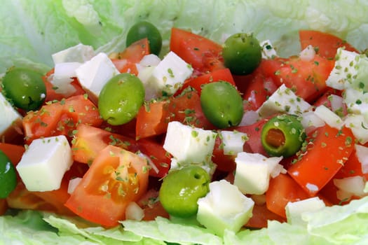 greek salad wit tomato, cheese and olives