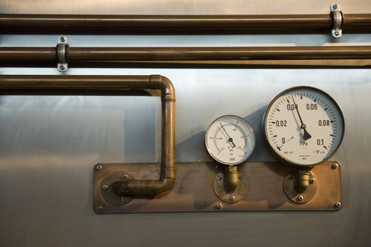 two industrial metres with pipes