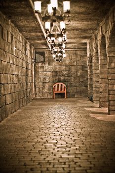 chair at the end of a creepy hallway