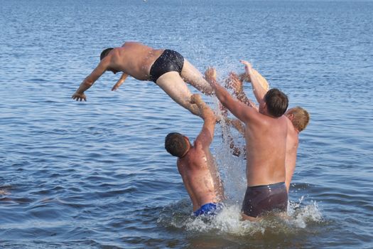 photo of the person jumping with heights in water