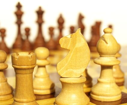 Wooden chessboard with light and dark wood checkers