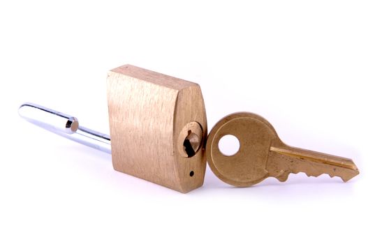 An unlocked brass padlock with key, isolated on white