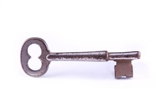 An antique skeleton key, isolated on white