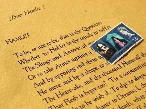 William Shakespeare's Hamlet (original Middle English text from the First Folio of 1623) with stamp - selective focus