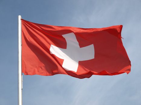Flag of Switzerland over a blue sky