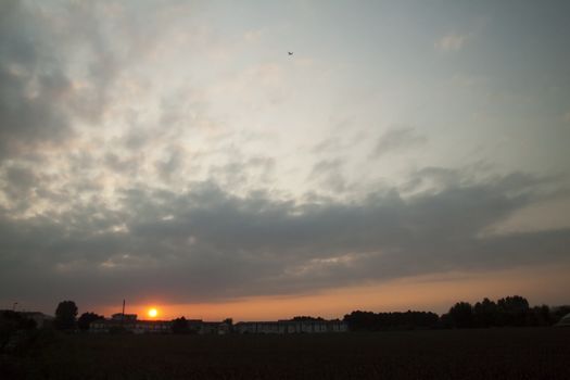 Landscape with great sky and clouds and setting sun