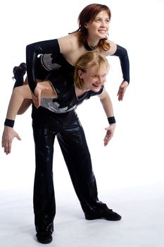 two dancers in same costumes on white
