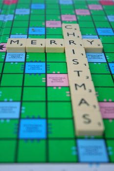 merry christmas inscription made of scrabble tiles