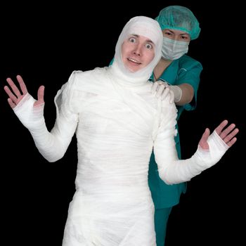 Funny sick in bandage and nurse isolated on black background