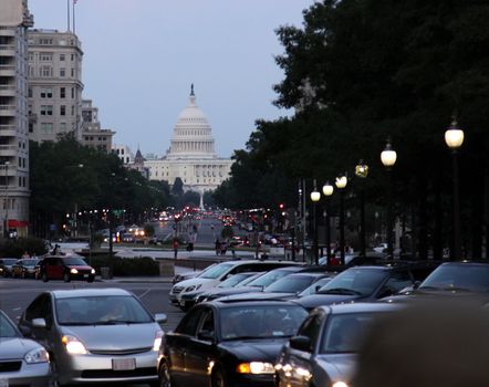 The traffic in Washington DC, with the Capitol building in the background.