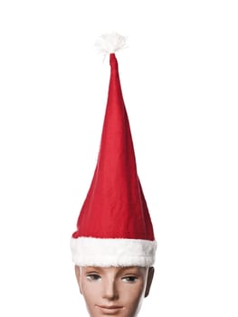 Santa claus hat on a doll isolated on a white background