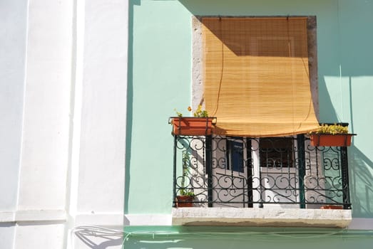 beautiful window balcony with flowers in Lisbon, Portugal