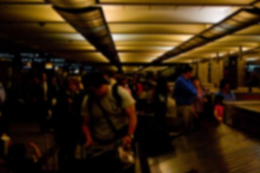 Passengers at Baggage Claim v1 captures the motion and hussle and bussle of activity at an airport. Bags are picked up or claimed. 
