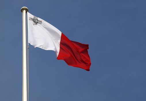 Flag of the Republic of Malta on blue sky