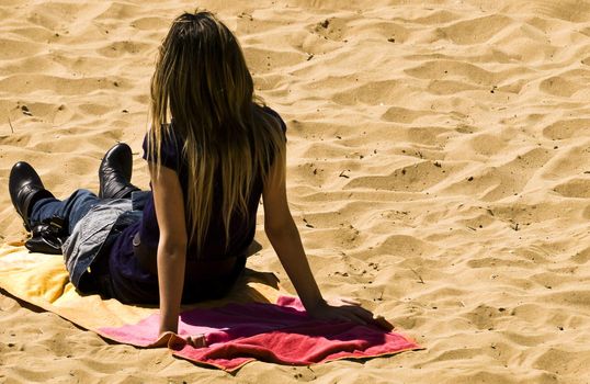 Woman iat the beach in spring in Malta