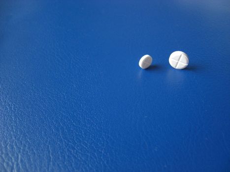 two pills looking at each other, imagery, background image for a pharmaceutical product