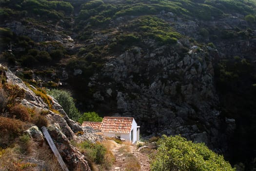 Small house in mountains with trees