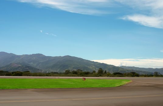 Small airport in mountains over blue sky