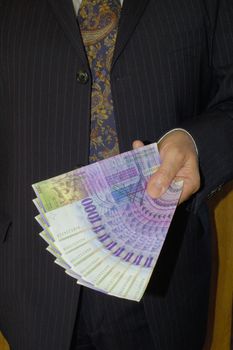 A pin-stripe-suited businessman, offering 8'000 Swiss francs.