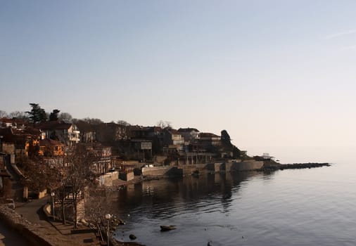 Little island with small houses in sea