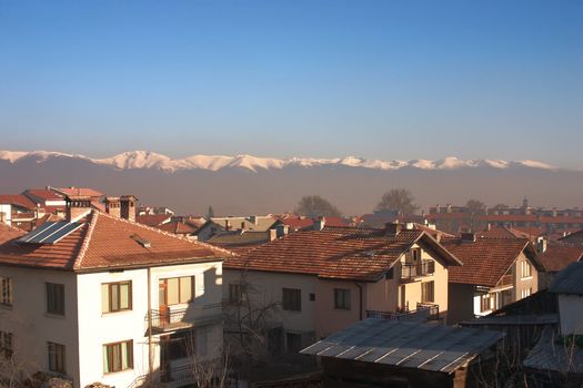 Lots of small houses in mountains with sky