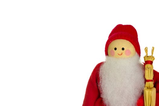 A wooden Father Christmas doll, holding a straw reindeer, isolated on a white background. Space for text.
