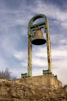 Big bell in old antique fort with sky