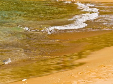 Waves crashing on the coast on a beach in Malta