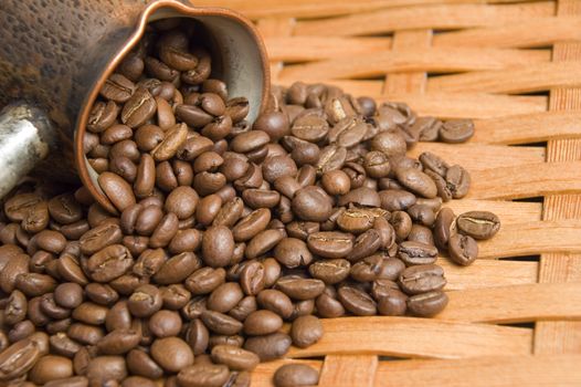 Turkish coffee pot and coffee beans.