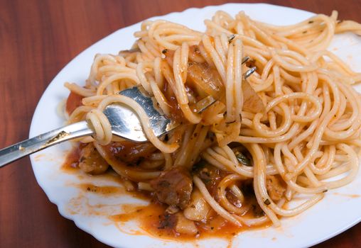 fork with spaghetti,Delicious pasta close-up .meat sauce