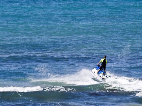 Man riding a powerful jetski on the waves in Malta