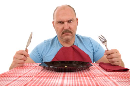 Mature man looking very angry with the content of his plate