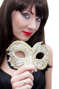 Mysterious woman holding venetian mask isolated on white. Mask in focus