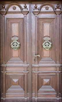 an old door knocker on ancient door
