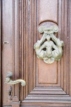 an old door knocker on ancient door